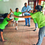Students demonstationg how a clean world depends on everyone