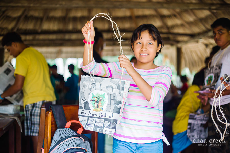 eco kids summer camp 2019 day 7 girl posing with crafts handbag