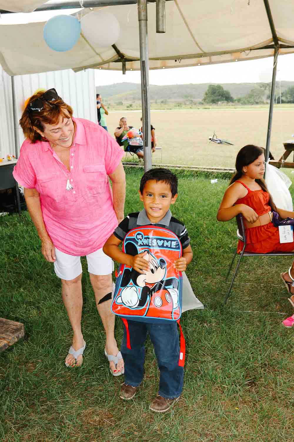 chaa creek corozalito funday little boy happy smile with school bag