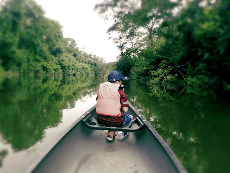 belize canoeing macal river young kid in front