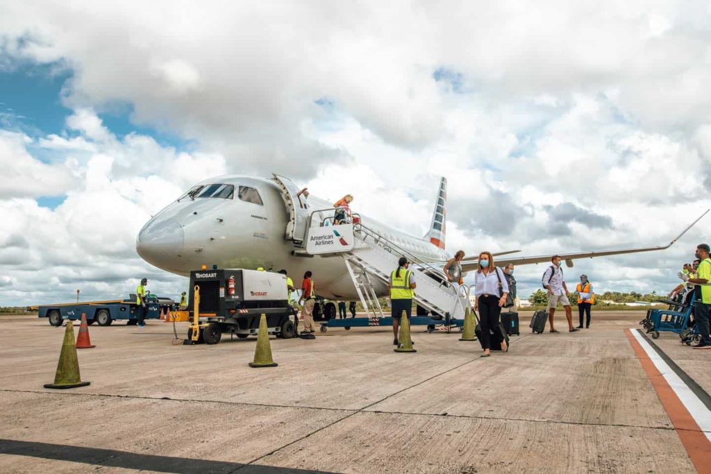 photo of passengers disembarking an american airlines flight at belize philip goldson airport