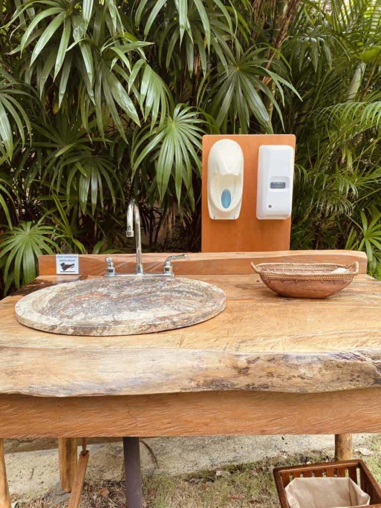 photo of contactless hand sanitizing station at chaa creek