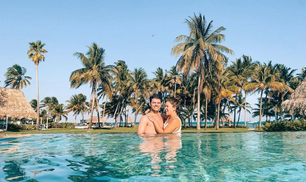 Couple in pool at Victoria House Resort on San Pedro Island
