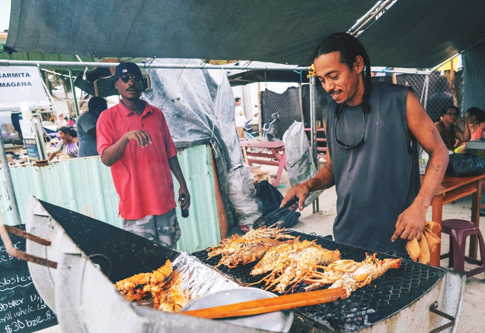 grilling lobster at the annual caye caulker lobster fest