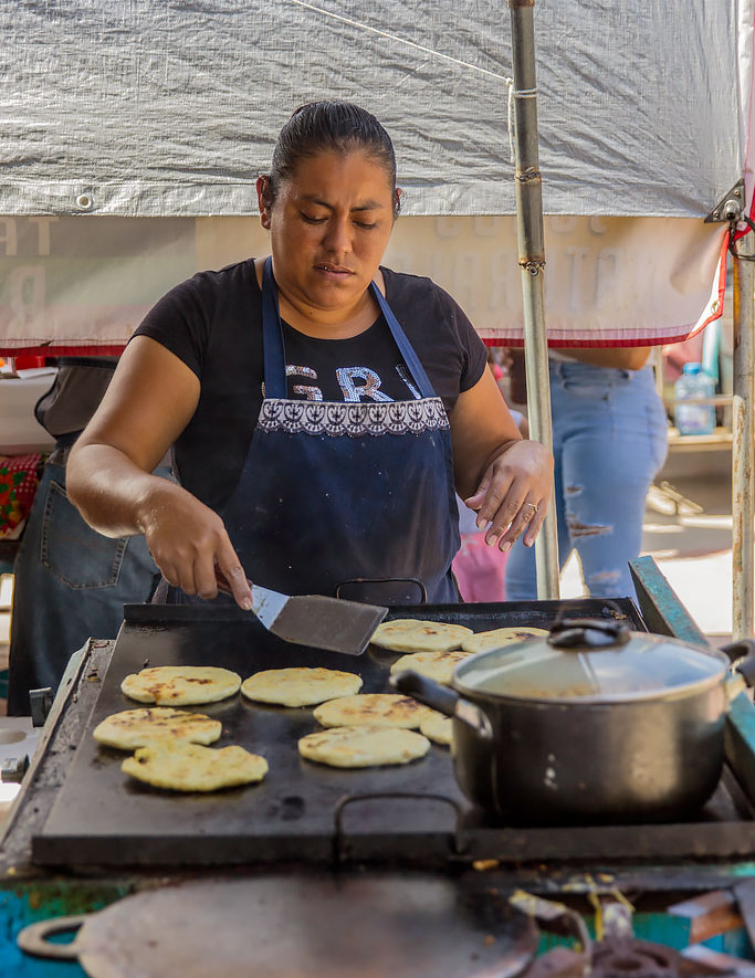 ladies making popusas at the San Ignacio farmers market