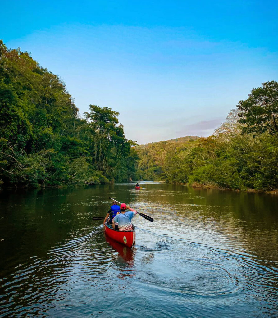 Canoeing down the Macal River in Belize at Sunset