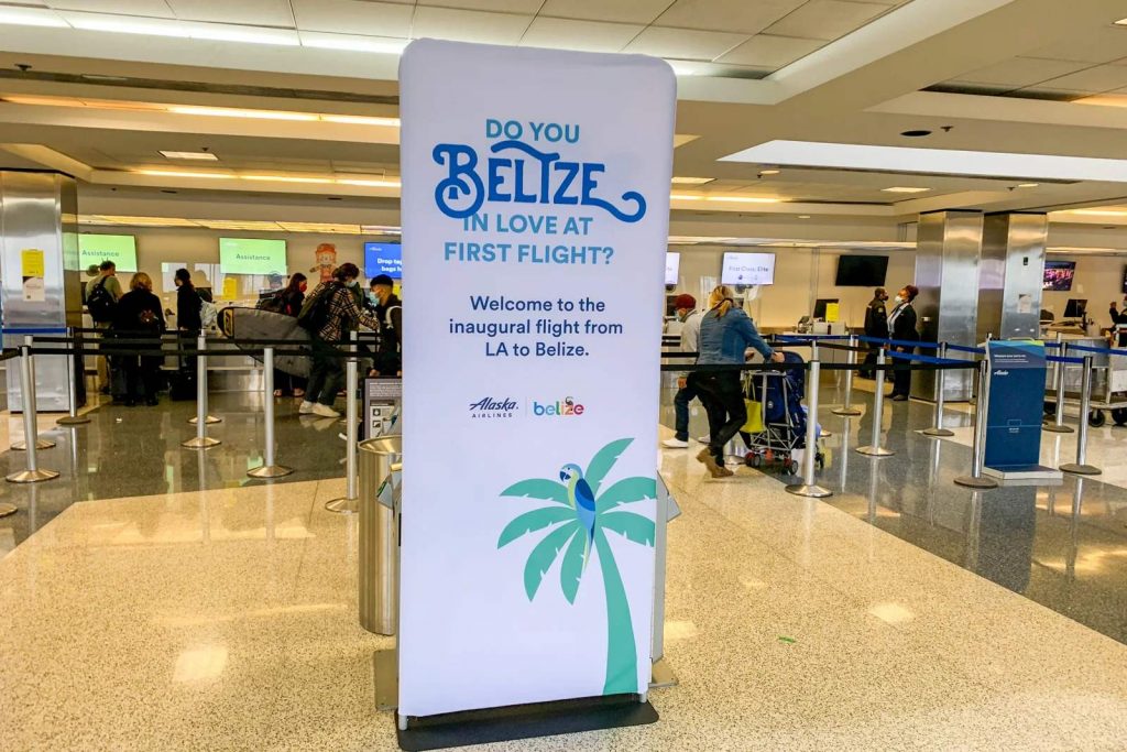 alaska airlines sign at los angeles for belize direct flights