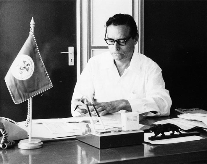 george cadle price at his desk belmopan